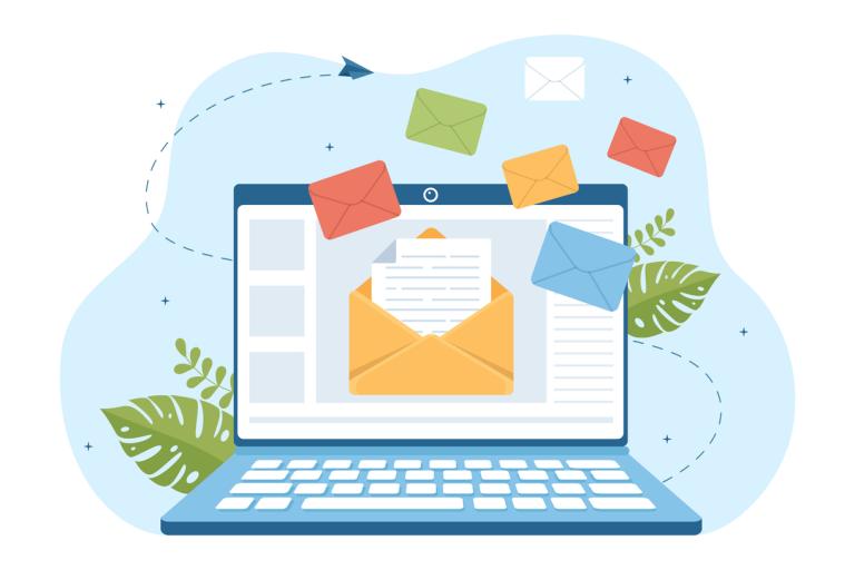 various newsletter related items such laptops and envelopes