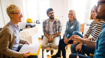 Group of people sitting in a circle