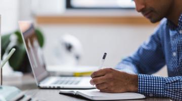 Man studying at a laptop