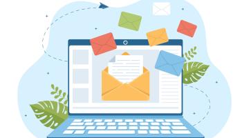 various newsletter related items such laptops and envelopes